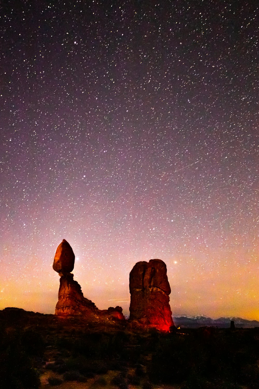 brown rock formation under blue sky during night time