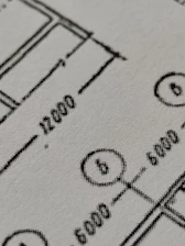 Close-up of a technical drawing being digitized on a computer screen.