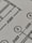 Close-up view of a technical drawing or blueprint featuring measurements and diagrams. The image shows lines, numbers, and symbols commonly used in architectural or engineering designs.