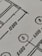 Close-up view of a technical drawing or blueprint featuring measurements and diagrams. The image shows lines, numbers, and symbols commonly used in architectural or engineering designs.