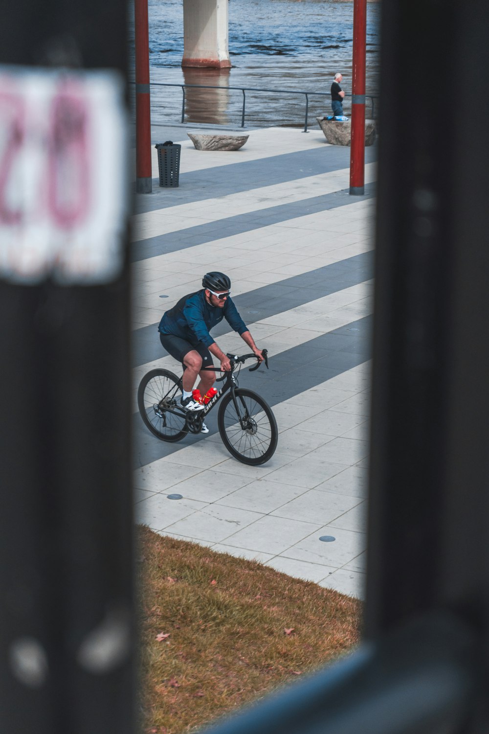 man in black jacket riding bicycle