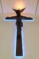 A serene painting of Jesus Christ with soft light illuminating his face, evoking peace and hope.