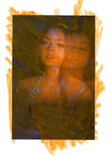 A portrait of a person with an overlay effect, making the person's face appear duplicated and creating a blurry, dreamlike appearance. The background and the edges of the image have an abstract, textured effect in orange, contrasting with the darker tones within the portrait.
