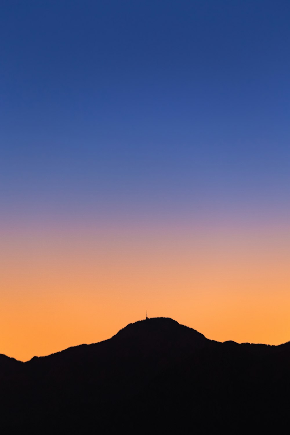 silhouette of mountain during sunset