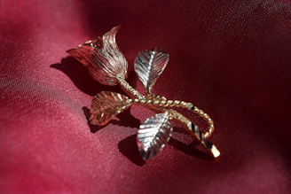 Dusty rose textured background with subtle gold accents reflecting luxury.