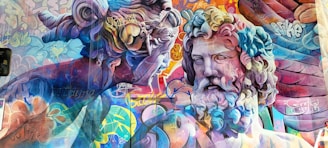 A vibrant mural featuring two classical-style sculptures interwoven with colorful graffiti art. The sculptures have intricate details with swirling hair and expressive faces, surrounded by layers of vivid graffiti text and patterns. The use of bright and bold colors enhances the dynamic contrast between the traditional sculptures and modern street art elements.