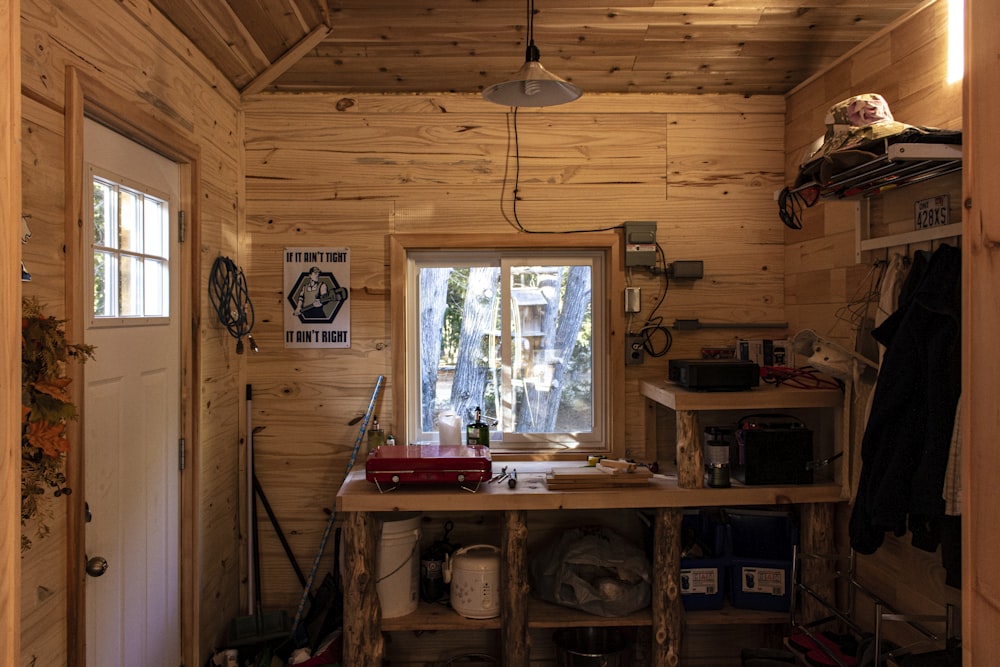 brown wooden table near window