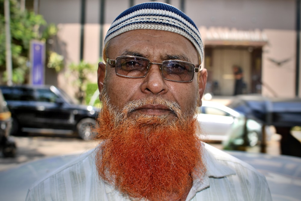 man in white dress shirt wearing black framed eyeglasses