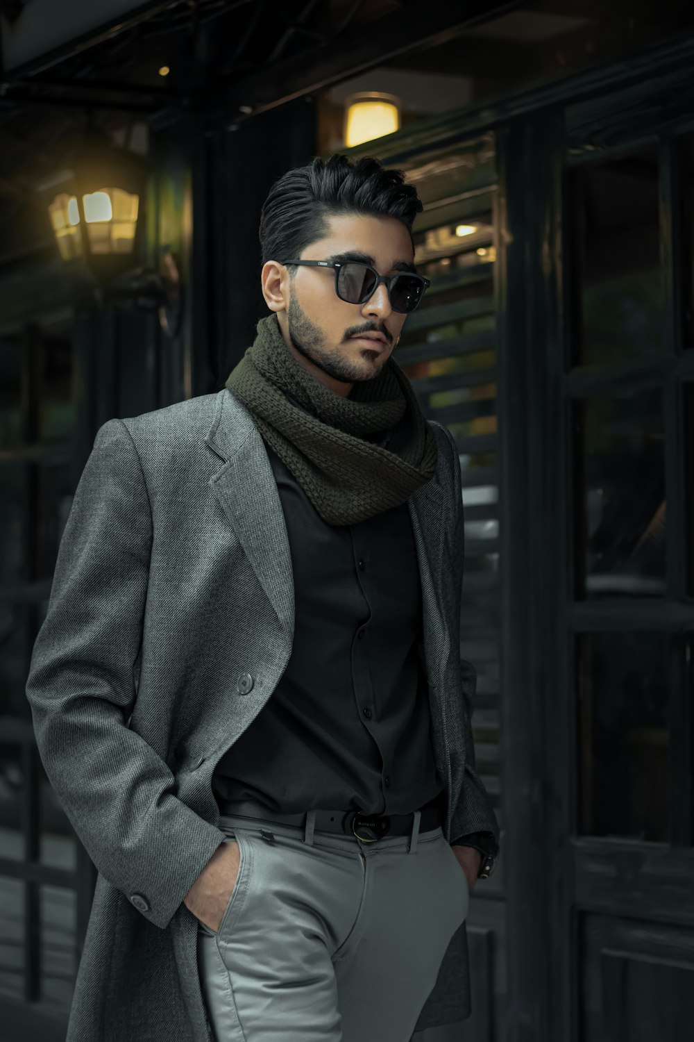 man in gray coat wearing black sunglasses