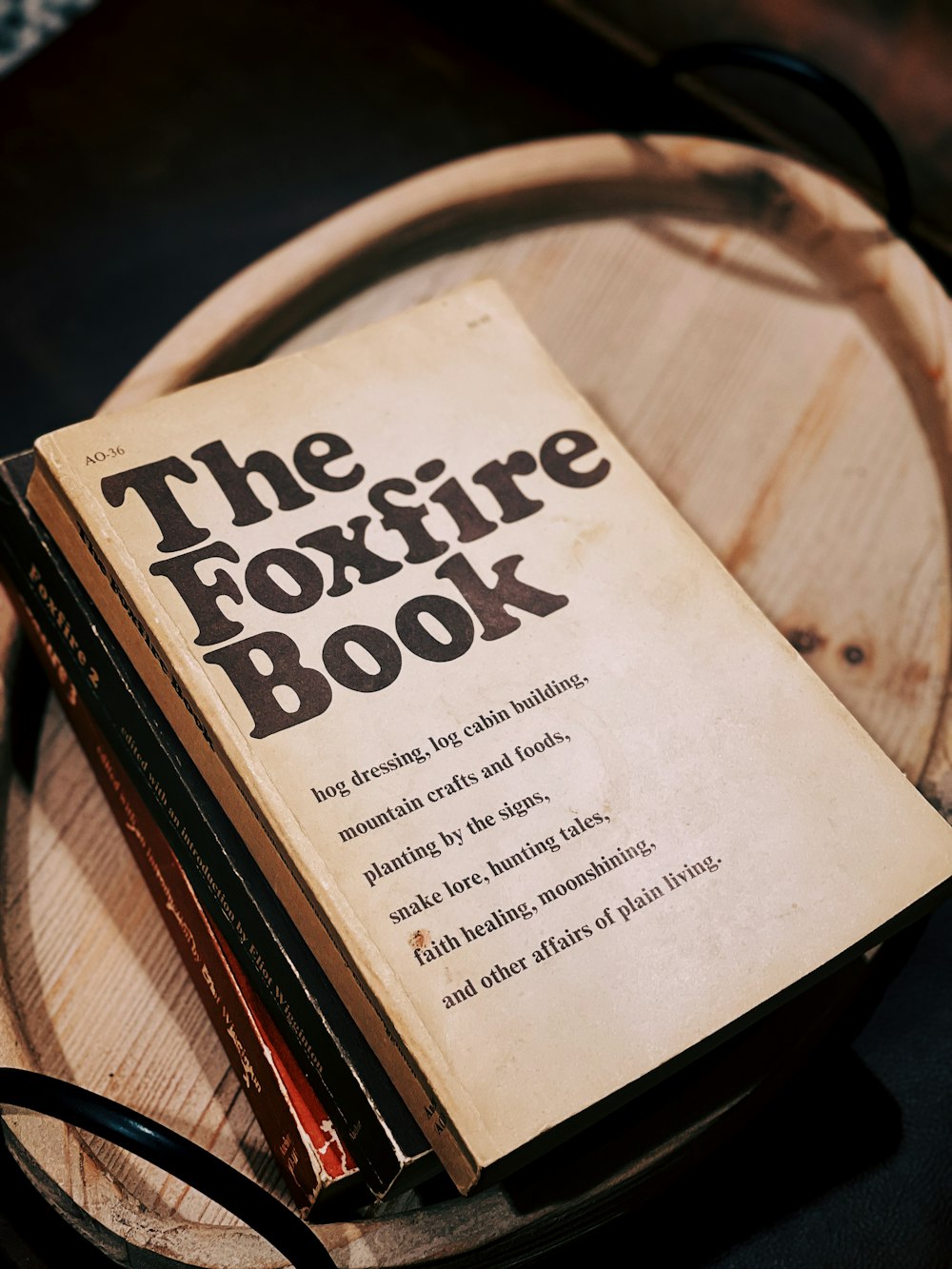 white and black book on brown wooden table