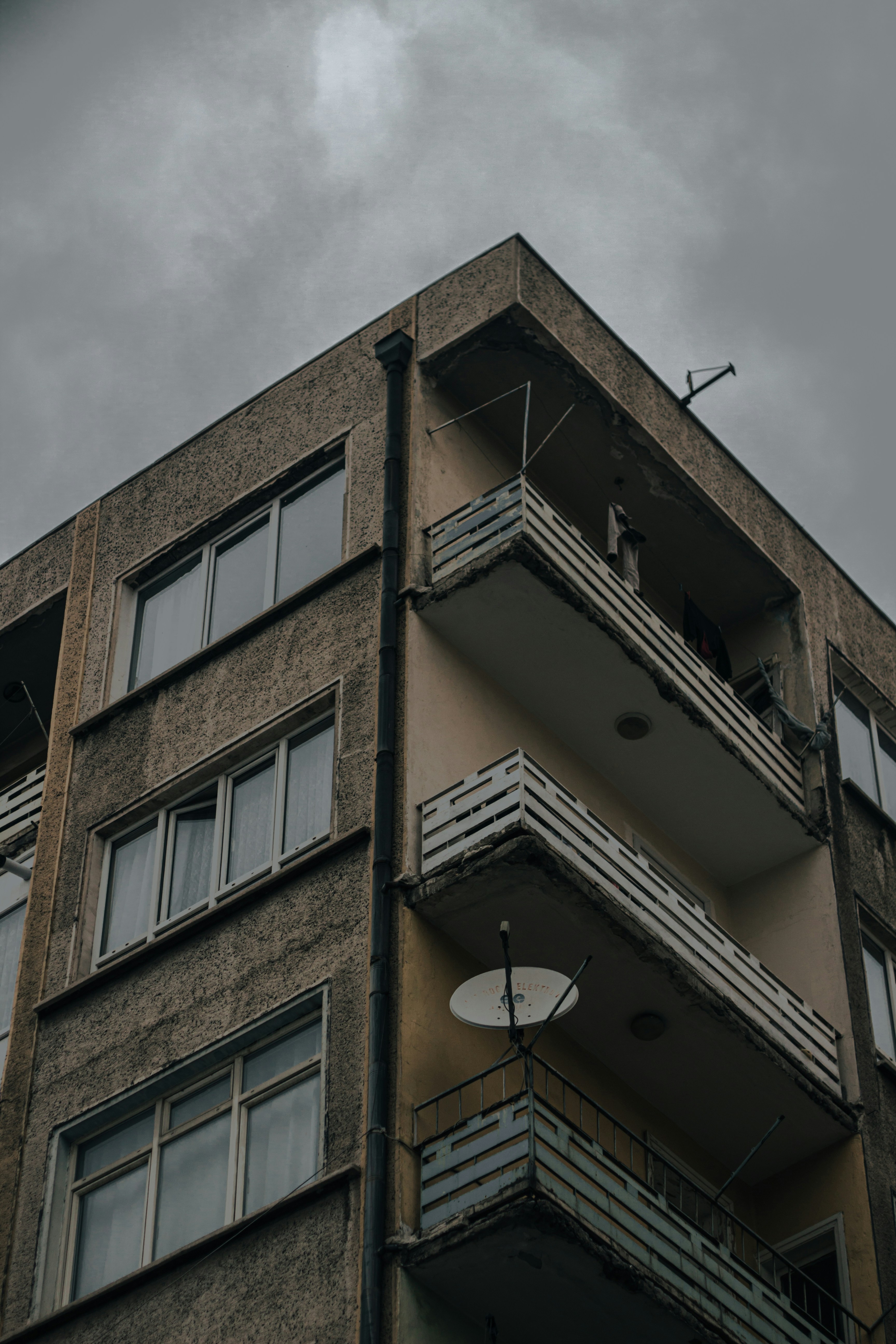 brown concrete building under gray sky during daytime