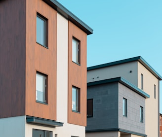 brown and white concrete building under blue sky during daytime