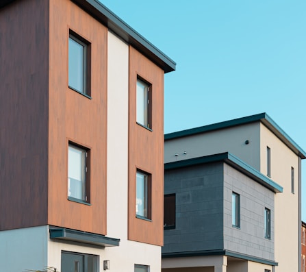 brown and white concrete building under blue sky during daytime