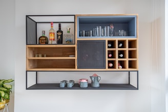 brown wooden shelf with bottles and jars