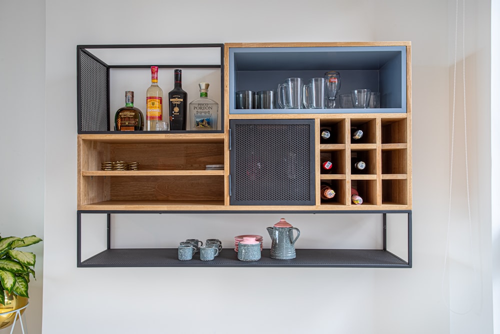 brown wooden shelf with bottles and jars