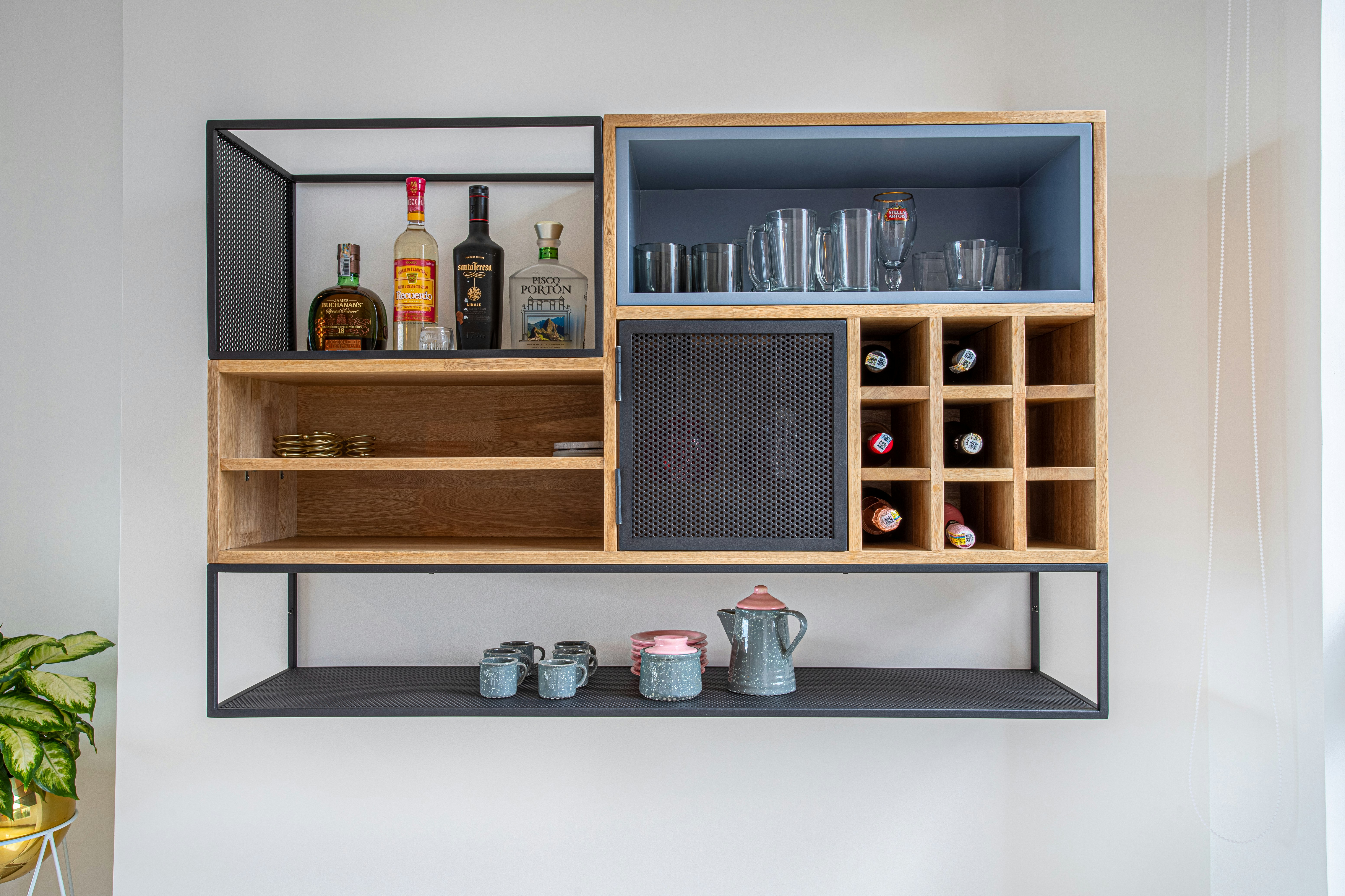 brown wooden shelf with bottles and jars