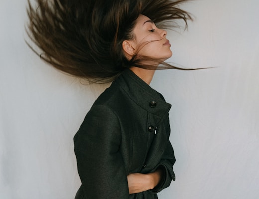 girl throwing her hair back