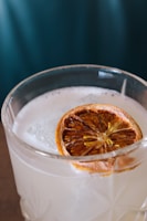 A close-up of a refreshing drink being poured into a glass.