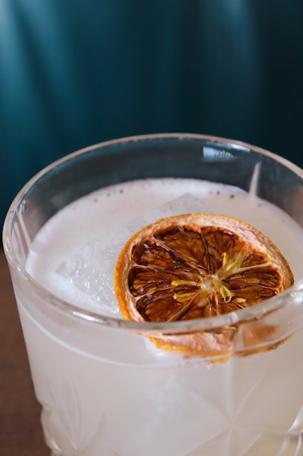 A close-up of a refreshing drink being poured into a glass.