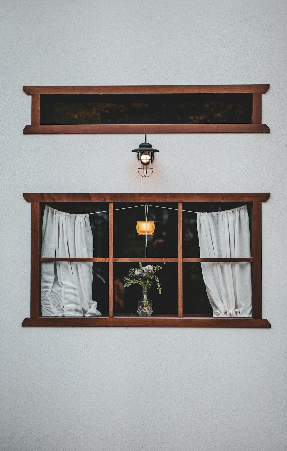 brown wooden framed glass window