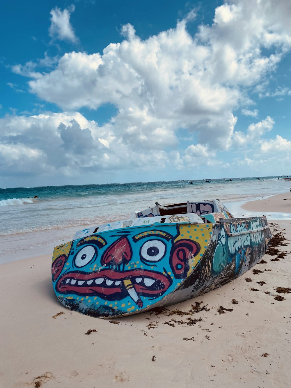 blue and white boat on beach during daytime