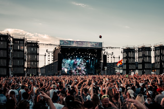 people gathering on concert during daytime