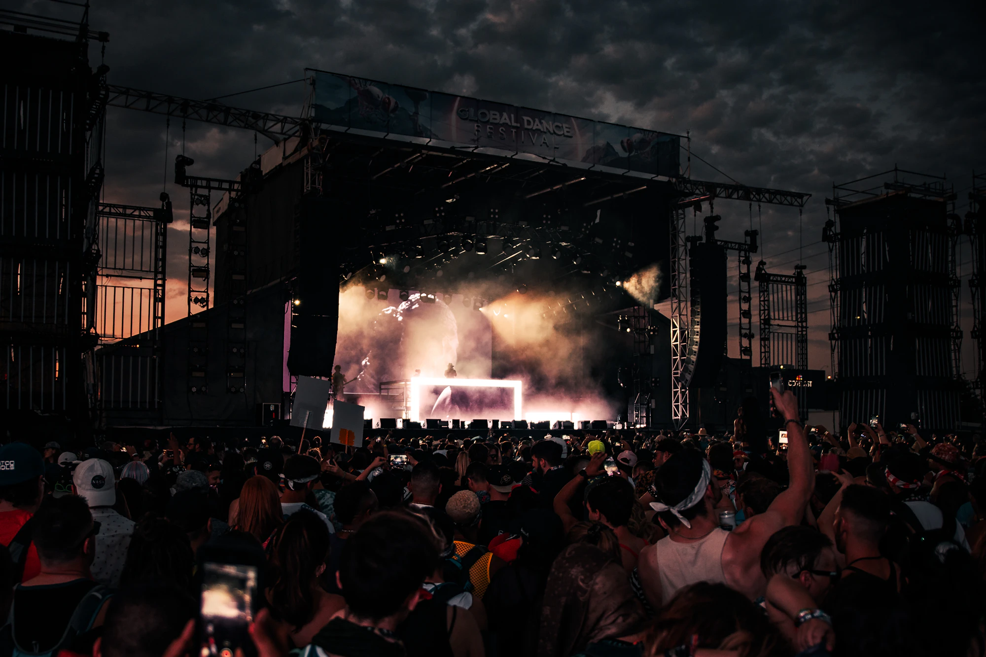 Night event crowd under stage lighting