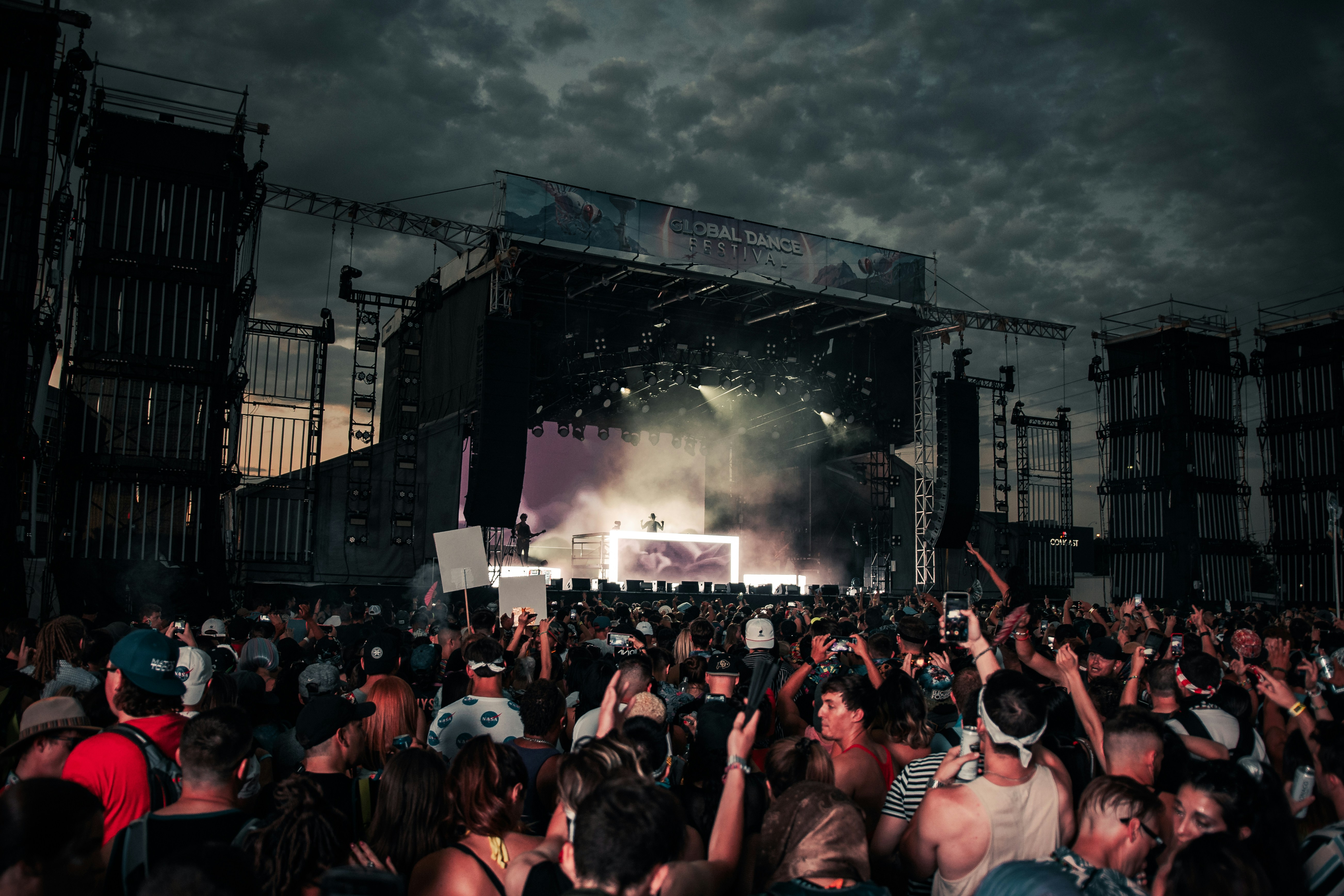 people gathering on concert during daytime
