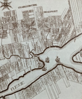 Fragment of a historical map rendered in soft watercolors, highlighting the Caribbean trade routes linked to Hamilton’s story