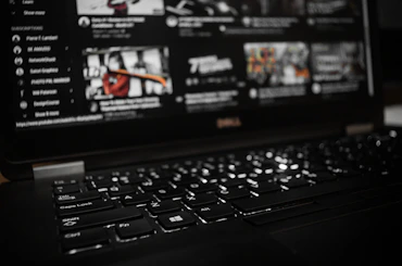 black laptop computer turned on displaying game application