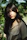 woman in brown blazer standing near green leaf plant during daytime