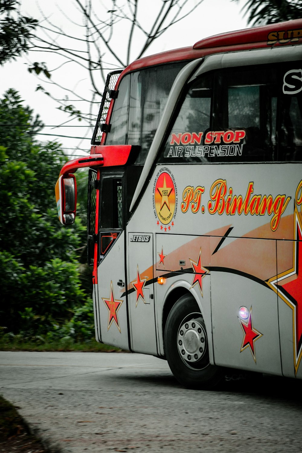 red and white bus on road during daytime