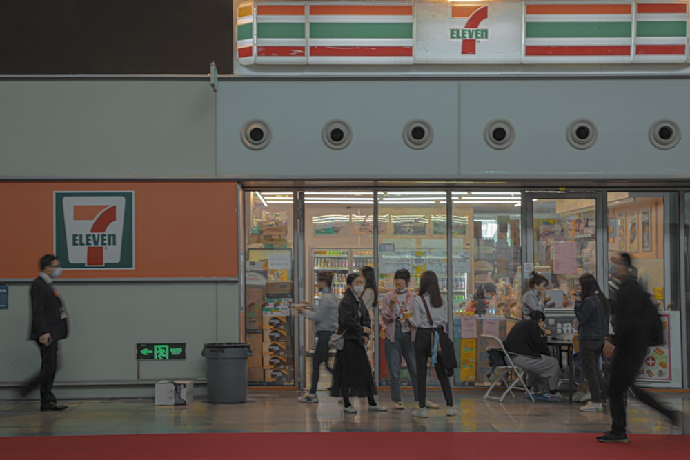 people walking in front of store