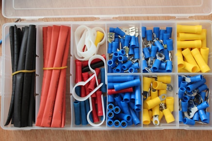 blue yellow red and white plastic tool