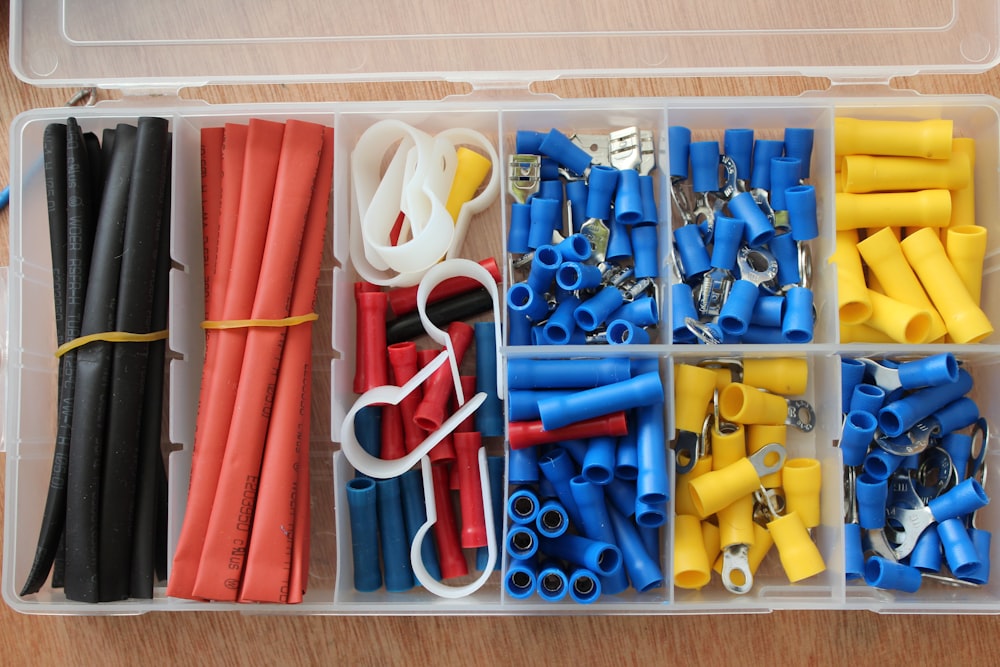 blue yellow red and white plastic tool