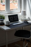 High-resolution photo of a sleek, minimalist workspace with natural light.
