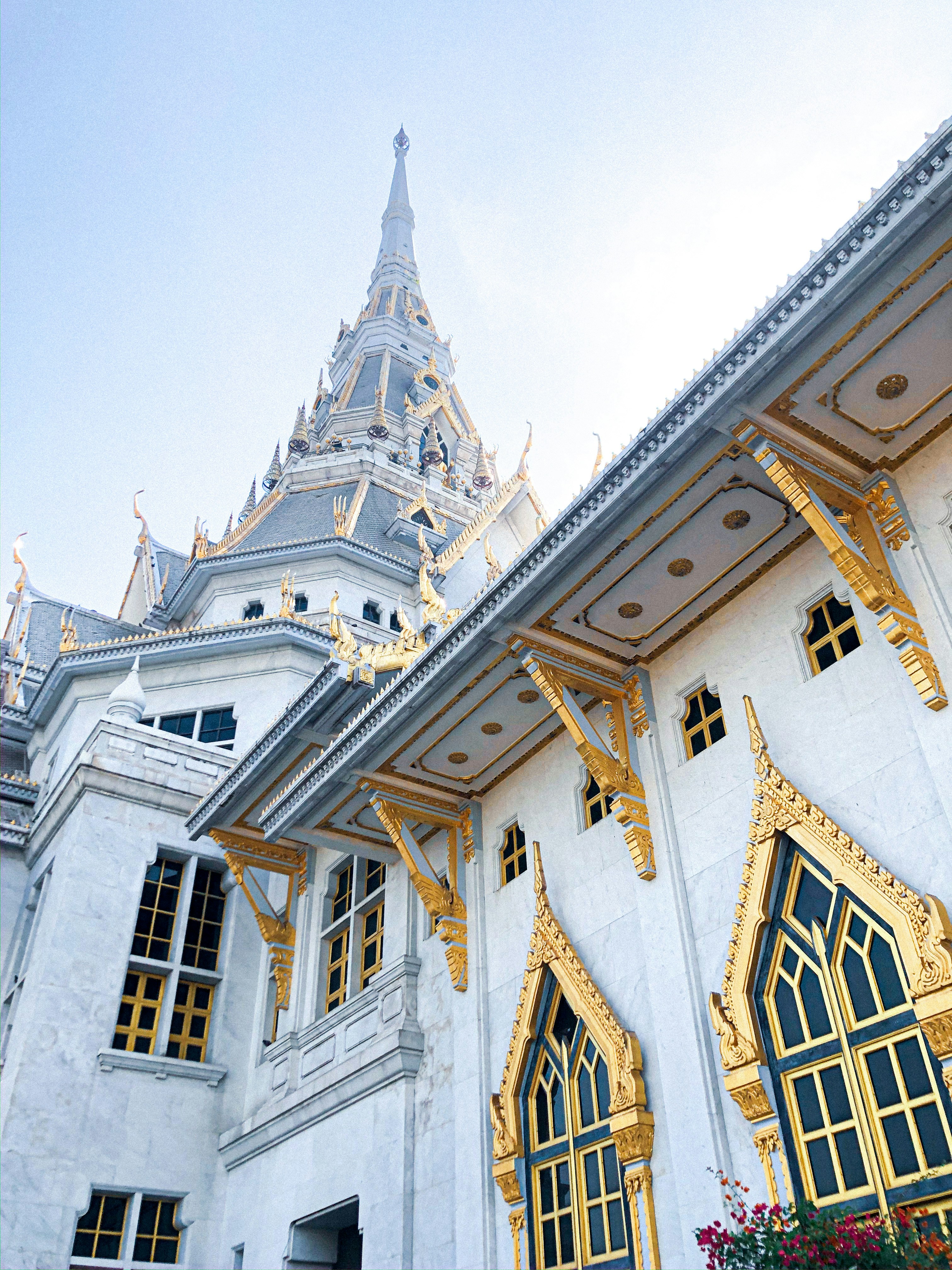 white and brown concrete building under blue sky during daytime