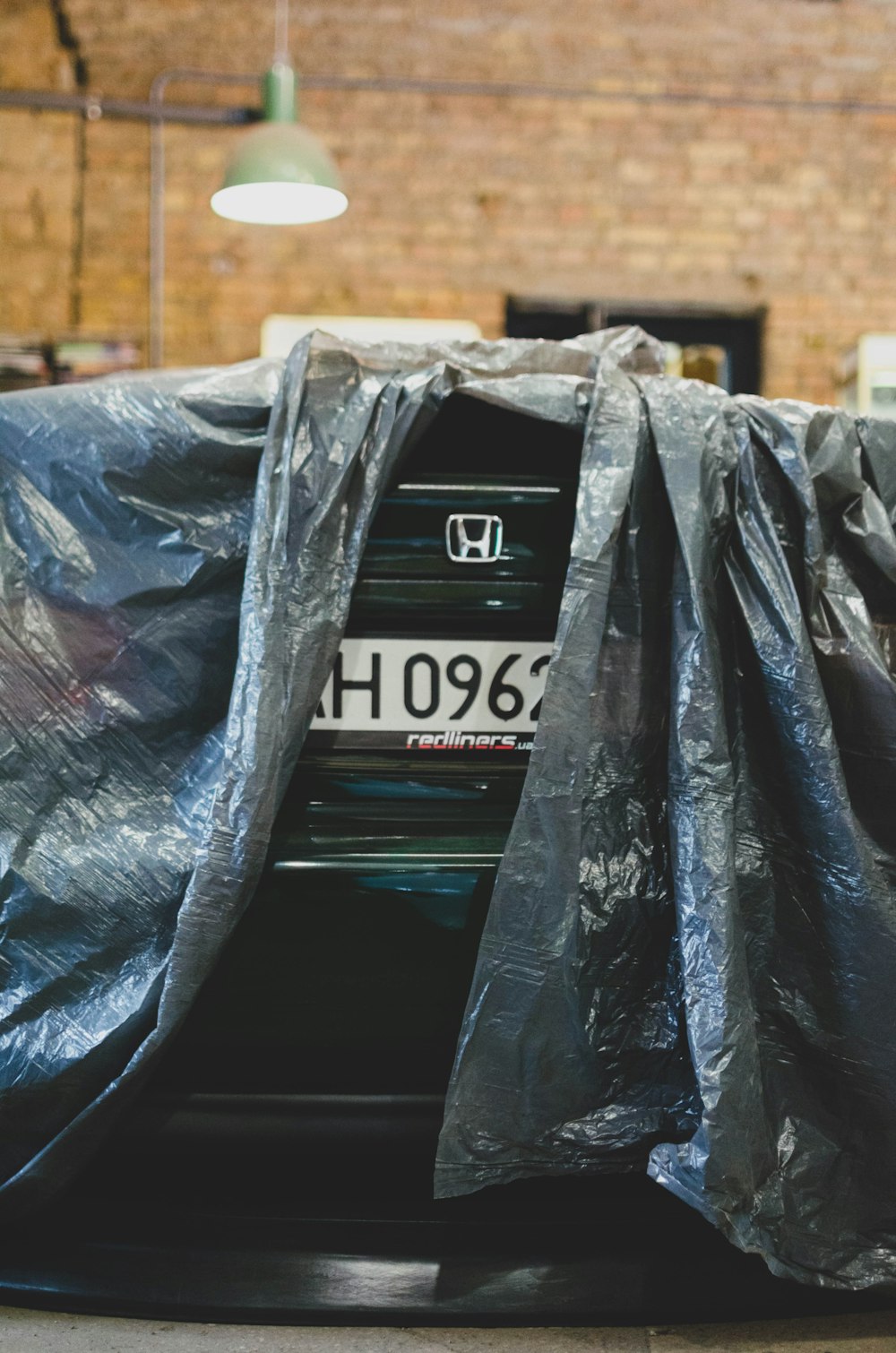 black plastic bag on brown wooden table