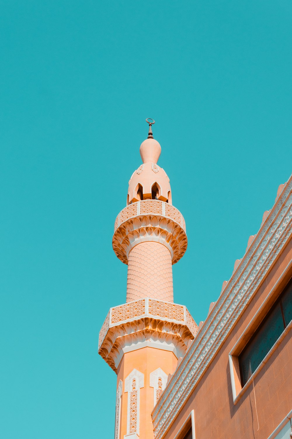 white concrete tower under blue sky during daytime