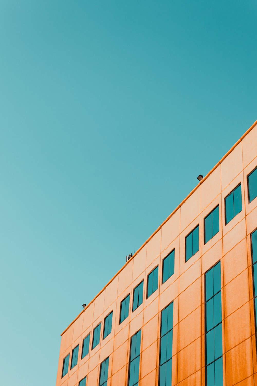 brown concrete building under blue sky during daytime