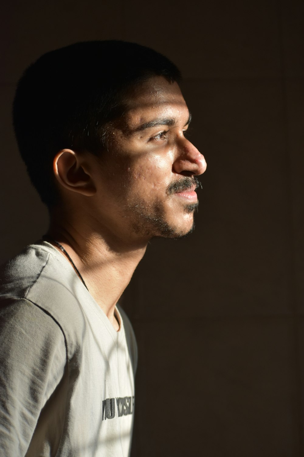 man in gray collared shirt