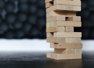 brown wooden blocks on black table