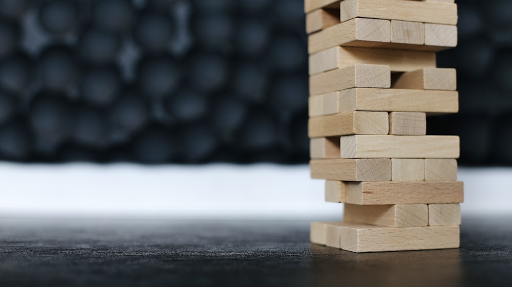 brown wooden blocks on black table