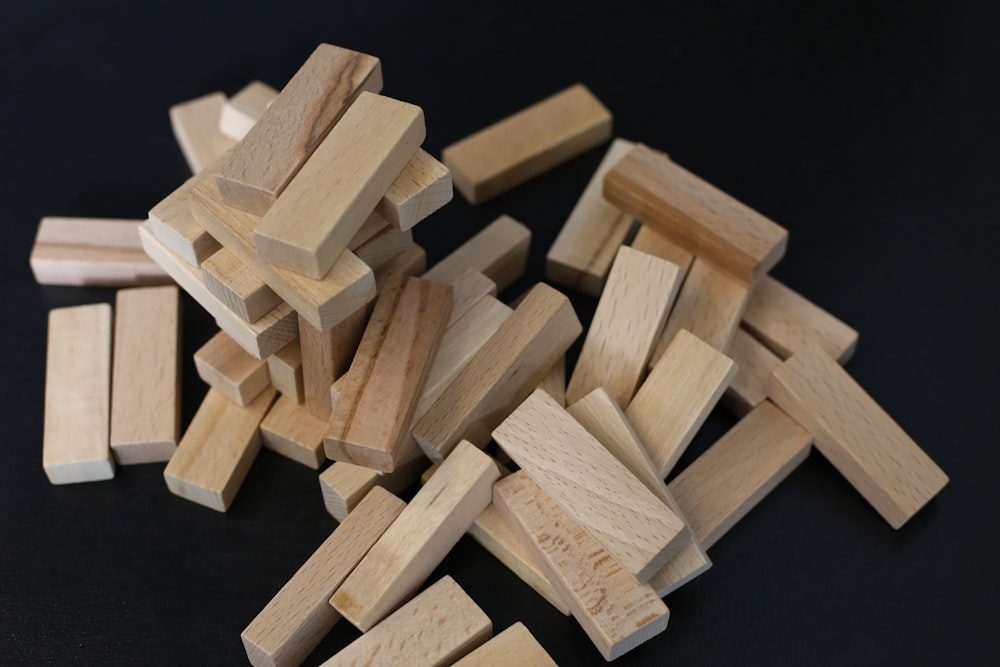 brown wooden blocks on black surface