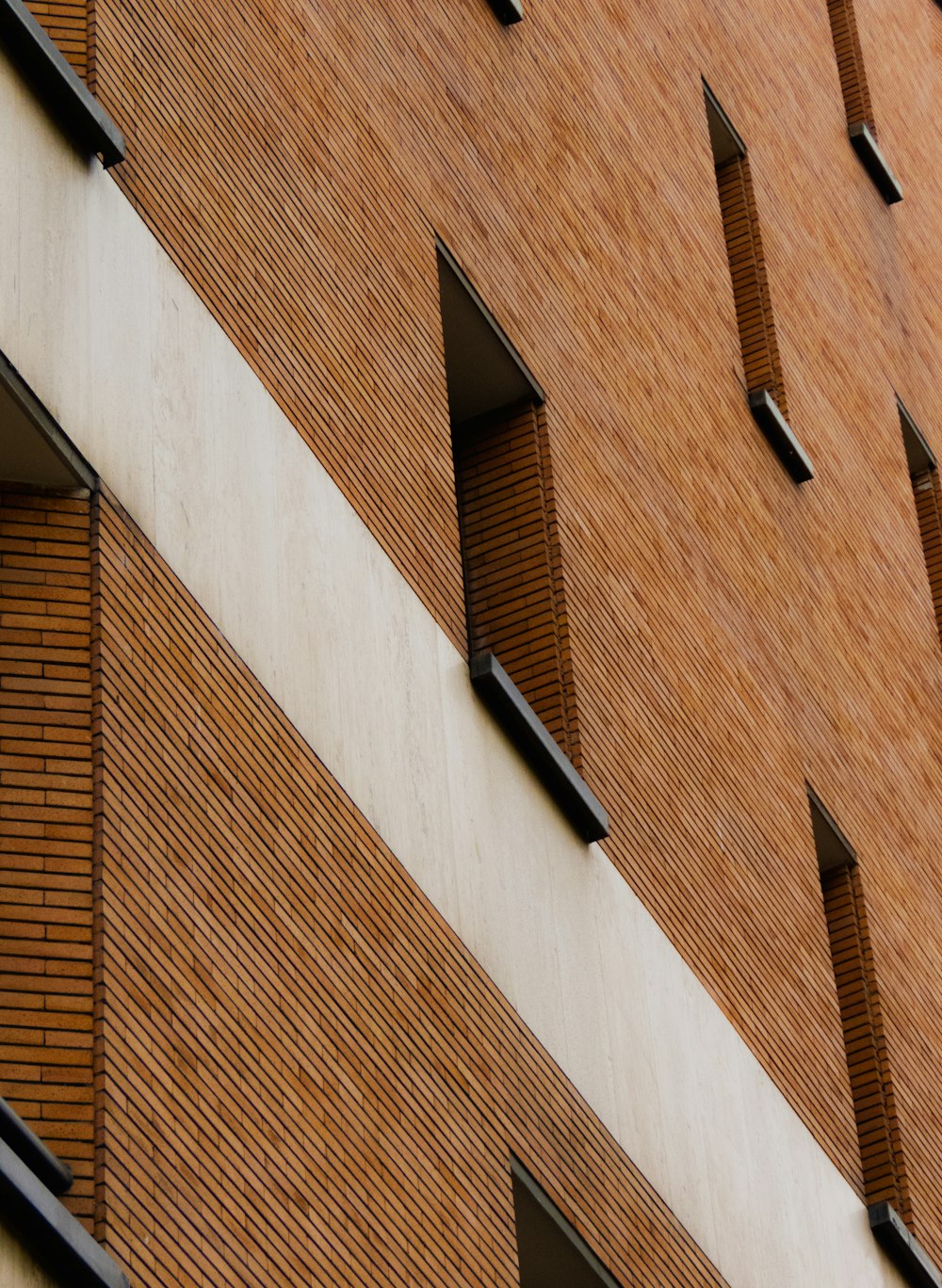 brown brick building with black window