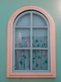 Two-leaf window painted in a soft pastel blue with transparent glass.