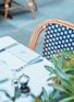silver and black round analog watch on white table