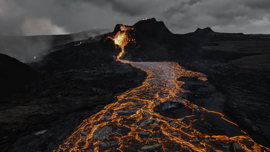 brown and black mountain under white clouds, Recent Fagradalsfjal volcanic eruption in Iceland.