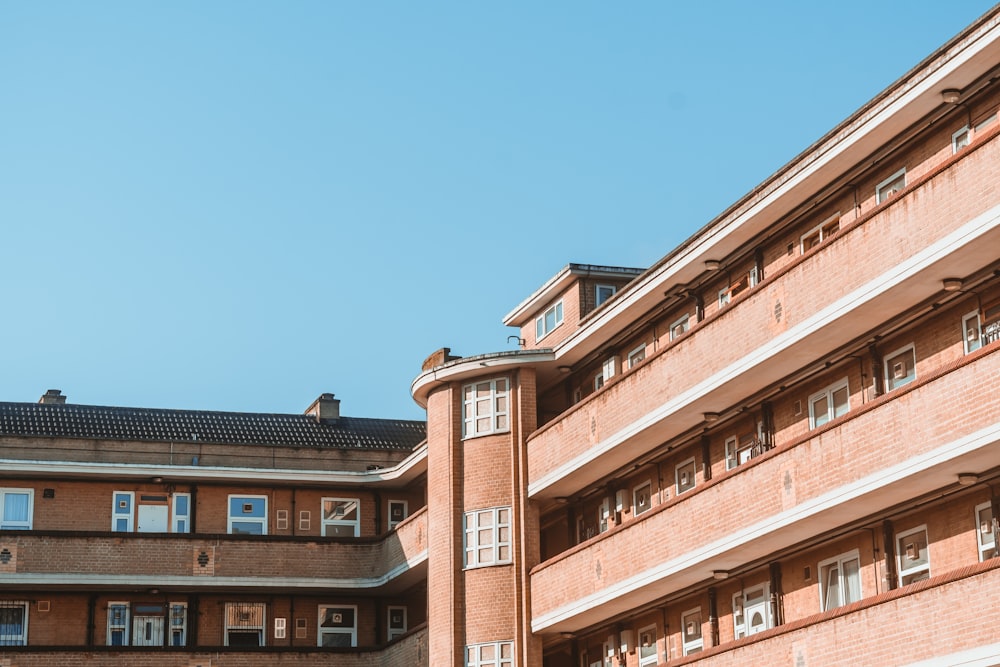 brown concrete building under blue sky during daytime