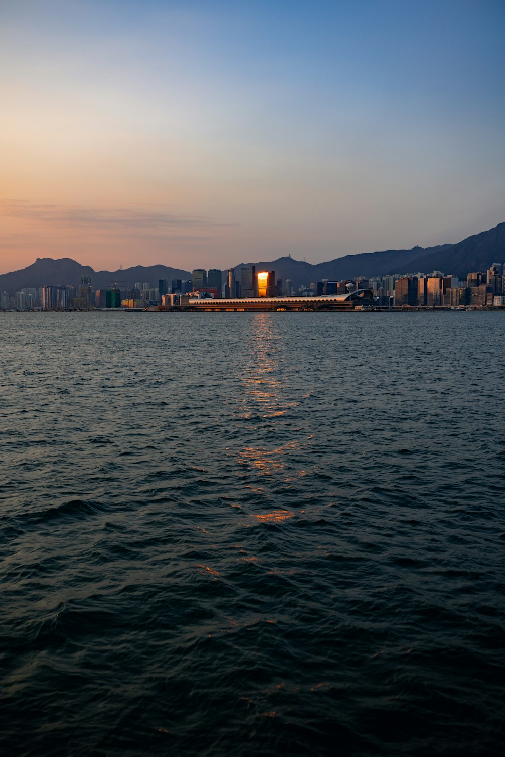 body of water near city buildings during daytime